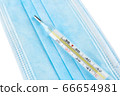 Mercurial thermometer and blue medical face mask 66654981