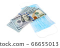 Blue medical face masks and stack of 100 USD banknotes 66655013