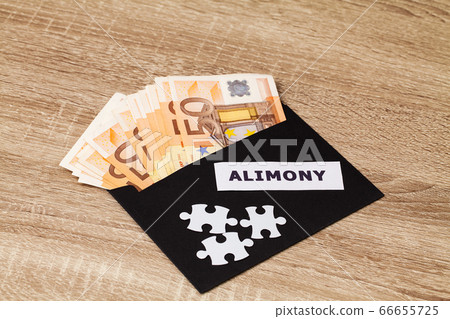 The concept of paying alimony, money in a paper envelope 66655725