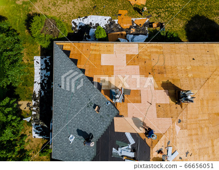 Home with roof replacing new shingles, felt paper, 66656051