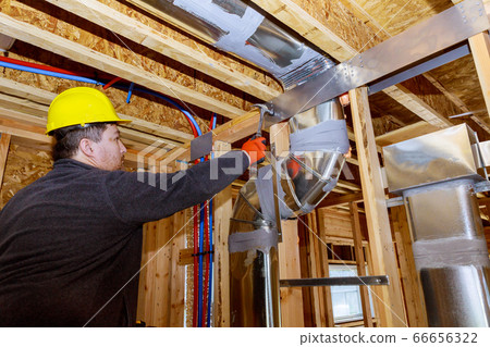 Workers making final air duct conditioning HVAC 66656322