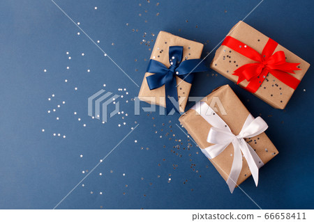 Red, blue and white gift boxes on classic blue Red, blue and white gift boxes on classic blue 66658411