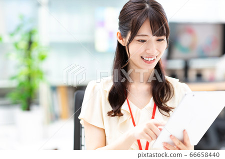 A woman working in an office 66658440