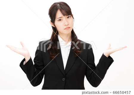 Woman in trouble pose in front of white background Woman in trouble pose in front of white background 66658457