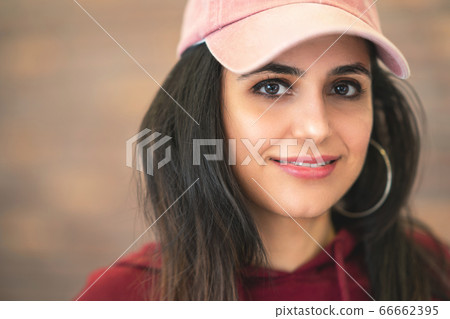 Happy  Smiling Beautiful Brunette Woman In Baseball Pink Cap With Long Hair Style In Fashion 66662395