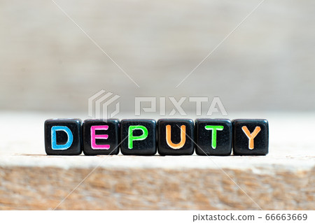 Black bead with color letter in word deputy on wood background Black bead with color letter in word deputy on wood background 66663669