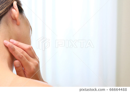 Woman with hands on her neck Woman with hands on her neck 66664488