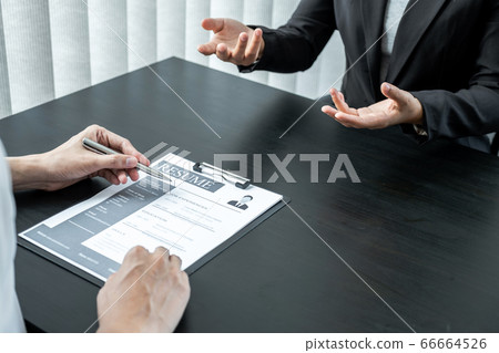 Office executives are interviewing job applicants in the meeting room Office executives are interviewing job applicants in the meeting room 66664526