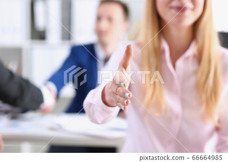 Businesswoman offer hand to shake as hello Businesswoman offer hand to shake as hello 66664985