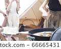 Women enjoying glamping (without faces) 66665431