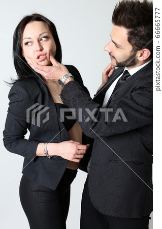 Fashion man and woman. The concept of male domination Fashion man and woman. The concept of male domination 66665777