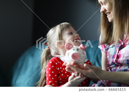 Sweet child in bright red dress in dots 66665815