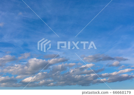 Gray clouds on blue sky background. 66668179
