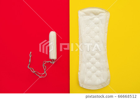 Women intimate hygiene products - sanitary pad and tampon on colorful background Women intimate hygiene products - sanitary pad and tampon on colorful background 66668512