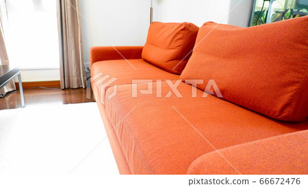 A living room with an orange sofa on the side of the window where the bright sun shines (Slightly below) 1500 A living room with an orange sofa on the side of the window where the bright sun shines (Slightly below) 1500 66672476