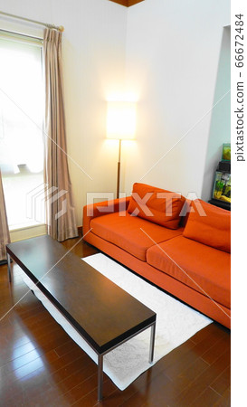 Living room (vertical screen) with an orange sofa on the side of the window where the bright sunlight shines 1483 Living room (vertical screen) with an orange sofa on the side of the window where the bright sunlight shines 1483 66672484