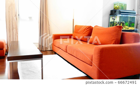 A living room with an orange sofa on the side of the window where bright sunshine comes in (with an aquarium) 1472 A living room with an orange sofa on the side of the window where bright sunshine comes in (with an aquarium) 1472 66672491