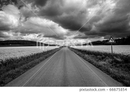 Amazing landscape in summer season, road sign indicating a bend Amazing landscape in summer season, road sign indicating a bend 66675854