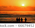First sunrise and youth silhouette 66679452