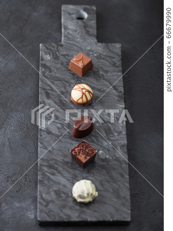Luxury Chocolate candies selection on black marbel Luxury Chocolate candies selection on black marbel 66679990