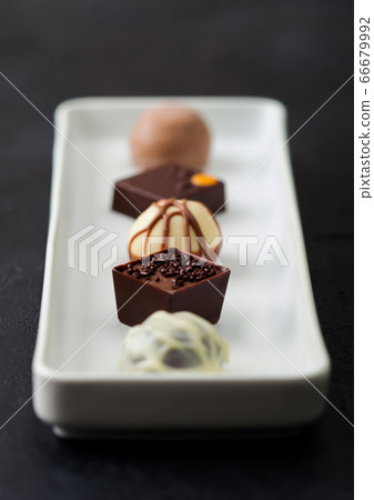 Luxury Chocolate candies selection in white Luxury Chocolate candies selection in white 66679992