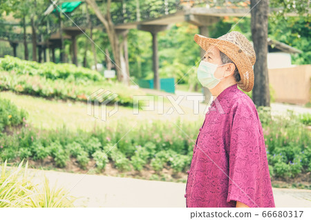 old elder woman wearing woman wearing medical mask old elder woman wearing woman wearing medical mask 66680317