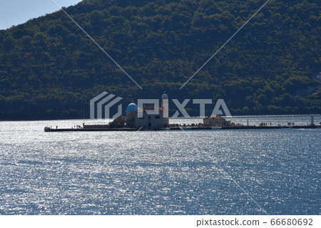 Haruki Tenki, small boat on the sea, small island on the sea. Haruki Tenki, small boat on the sea, small island on the sea. 66680692