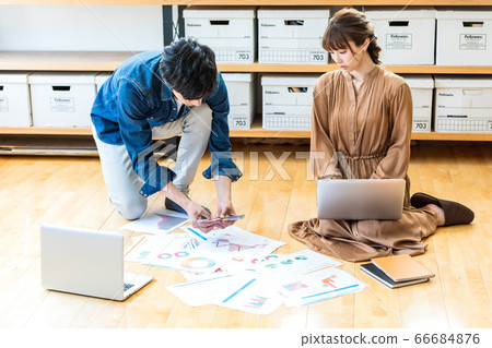 Business sitting on office floor Business sitting on office floor 66684876
