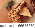 Fashionable bread on a wooden cutting board 66686750