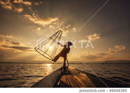 Intha Burmese fishermen on boat catching fish traditional at Inle Lake, Shan State, Myanmar 66688360