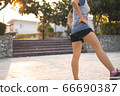 Fitness sports women warm up before have a run in 66690387