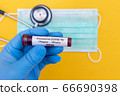 Hand holds a test tube containing a blood sample that has no the result positive or negative for coronavirus. 66690398