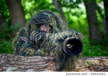Wildlife photographer in the summer ghillie Wildlife photographer in the summer ghillie 66691862