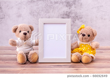 couple teddy bear with Picture frame on table couple teddy bear with Picture frame on table 66692649
