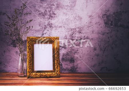 Picture frame with flowers on wall background and Picture frame with flowers on wall background and 66692653