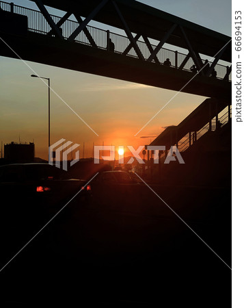 The silhouette of city bridge, road, car in Hong Kong downtown district at sunset 66694153