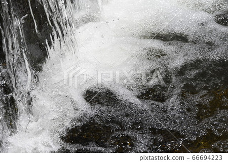 Abstract background of nature-Splash of stream weir 66694223