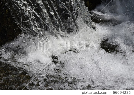 Abstract background of nature-Splash of stream weir 66694225