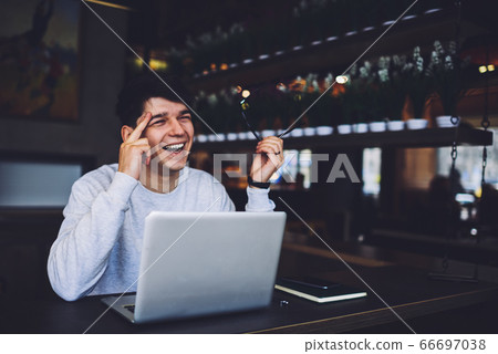 Portrait of positive smart student in trendy eyeglasses with black frame Portrait of positive smart student in trendy eyeglasses with black frame 66697038