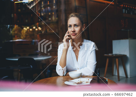 Smiling female lawyer is talking on mobile phone about her winning trial Smiling female lawyer is talking on mobile phone about her winning trial 66697462