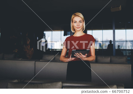 Attractive female watching video or reading business weblog in network Attractive female watching video or reading business weblog in network 66700752