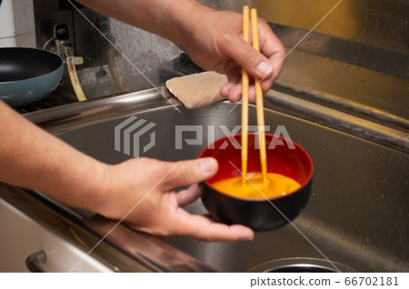 A man melting an egg A man melting an egg 66702181