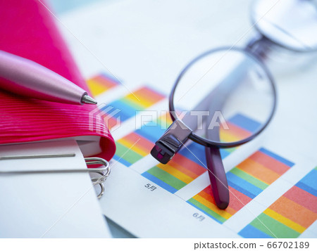 Business image, graph, glasses, documents, notebook, woman Business image, graph, glasses, documents, notebook, woman 66702189