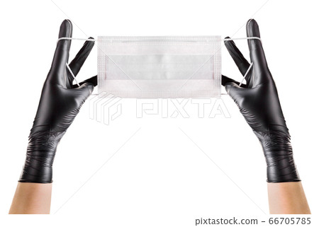 Hand in black gloves wearing disposable face mask Hand in black gloves wearing disposable face mask 66705785