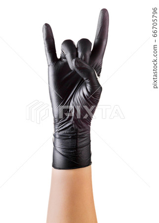Hand in black gloves showing rock n roll sign or Hand in black gloves showing rock n roll sign or 66705796