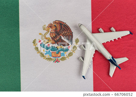 Flag of Mexico and model airplane. Resumption of Flag of Mexico and model airplane. Resumption of 66706052
