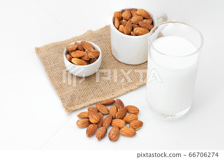 Milk Almonds in a glass on a white background Milk Almonds in a glass on a white background 66706274