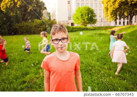 Little boy is trying to make friends with stranger kids 66707343