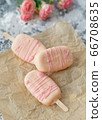 Gourmet ice cream dessert coconut-flavored iced chocolate glaze pink chocolate from a home bakery on gray background. Selective focus, copy space 66708635