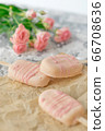 Gourmet ice cream dessert coconut-flavored iced chocolate glaze pink chocolate from a home bakery on gray background. Selective focus, copy space 66708636